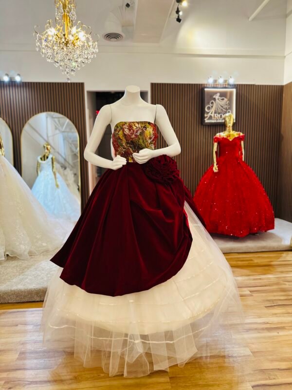 Strapless ballgown features a painted-style bodice in rich shades of red, gold, and orange with a large sculpted rose (Medium Size - Burgundy Red )
